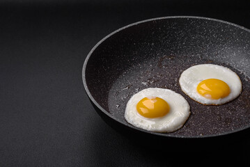 Delicious nutritious English breakfast with fried eggs and tomatoes