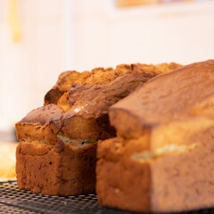 Hot bread fresh from the oven letting cool on marble table