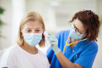 Doctor examining sick patient. Ill woman in clinic