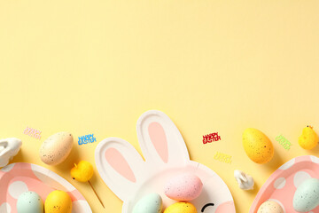 Easter greeting card or banner template with colorful Easter eggs and tableware on yellow background