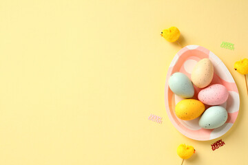 Happy Easter banner template. Colorful Easter eggs on plate in form of egg. Top view. Flat lay.