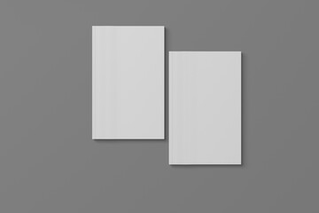 Fototapeta premium 2 softcover book mockups are standing on a gray background, designed with 3D render visual effects that are indistinguishable from reality. A mockup, with flashy white covers resembling a real book.