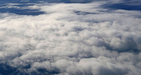 Clouds photographed from an airplane window