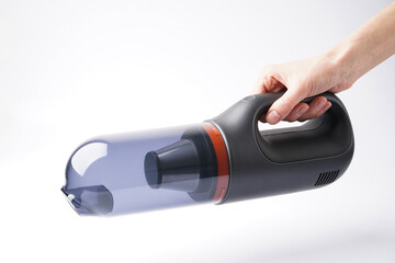 Hand hold vacuum cleaner on white background.