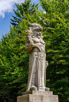 Statue of Radegast god holding a trophy with a duck and bull head at the top of the mountain Radhost in the Czech Republic