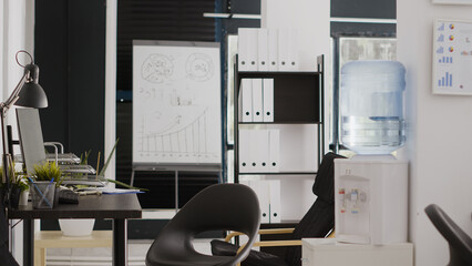 Business offices with computers for creative occupation, empty boardroom open space used for people with corporate jobs. Digital agency workspace with professional workstations.