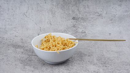 Instant noodles in white bowl. selective focus