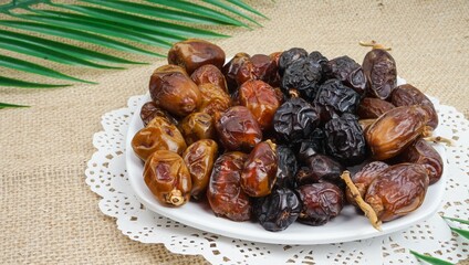 Dates or dattes palm fruit in wooden plate is snack healthy, Set of various dates in white plate