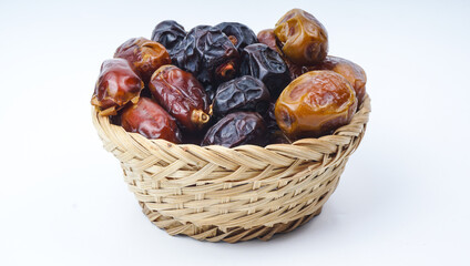 Different types of Dates Fruit or Kurma in mini basket. selective focus