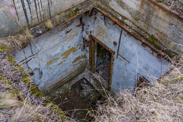 Destroyed airlocks of a military secret abandoned bunker. Background