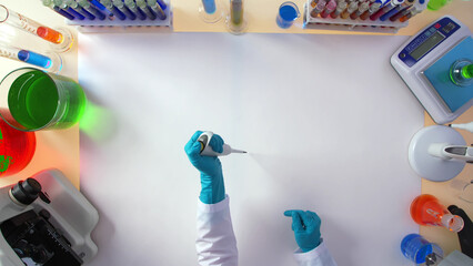 Top view of a female lab assistant working in a chemical laboratory