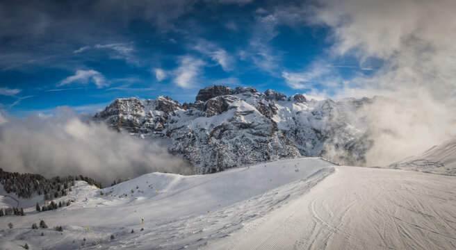 A beautiful view of Brenta Dolomites with fantastic clouds and Alps Madonna di Campiglio, Pinzolo, Italy. January 2023