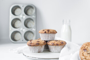 Homemade chocolate chip muffins with selective focus, bakery style chocolate chip muffins with white liners