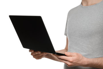 A man in a gray t-shirt holds an ultrabook, laptop in front of him