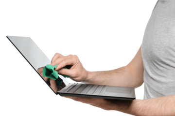 A man in a gray T-shirt wipes the screen of an ultrabook, laptop with a green rag