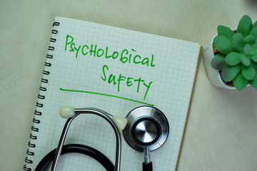 Concept of Psychologial Safety write on book isolated on Wooden Table.