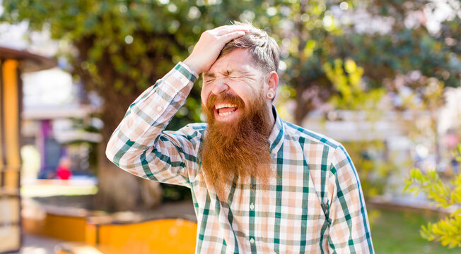 Red Hair Bearded Man Laughing And Slapping Forehead Like Saying D’oh! I Forgot Or That Was A Stupid Mistake