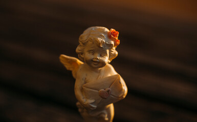 statue of a angel with a flower