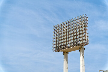 a lighting structure with a blue sky background