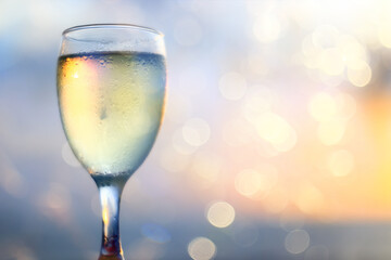 a glass of white wine in a restaurant, alcohol luxury background