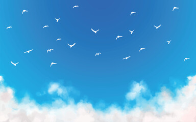 青空と雲と羽ばたく鳥