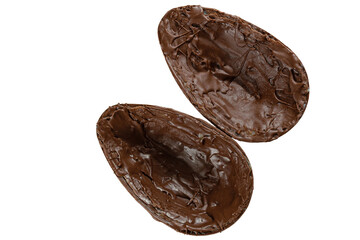 Two chocolate Easter egg halves filled with white chocolate and pistachios.