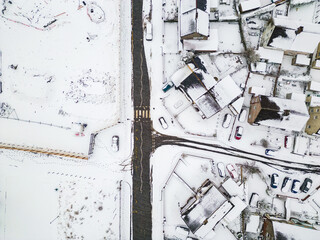 Aerial view of snow covered streets and roads during a blizzard (Wales)