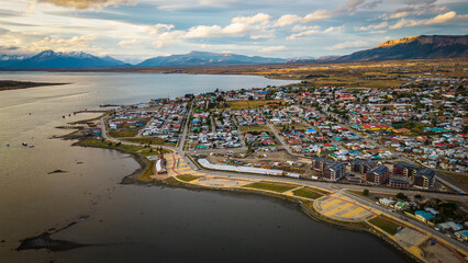 City of Puerto Natales Chile, Aerial Drone Above Town Buildings Amongst Patagonian Landscape of...