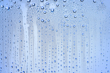 drops glass blue background abstract, transparent cold background water splashes
