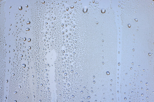 drops glass blue background abstract, transparent cold background water splashes