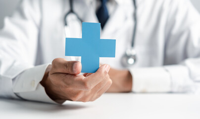 Doctor in white coat holding plus sign for assurance healthcare insurance symbol concept, Mental...
