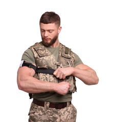 Fototapeta premium Soldier in military uniform applying medical tourniquet on arm against white background