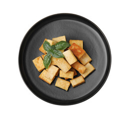 Plate with delicious fried tofu and basil on white background, top view