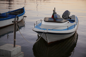 Beautiful view of river with moored boats at sunset