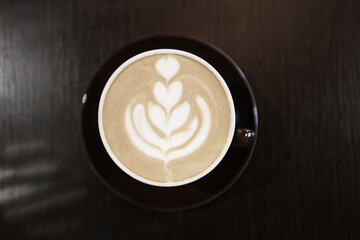 a cup of coffee in a cafe, photo morning coffee luvak cappuccino