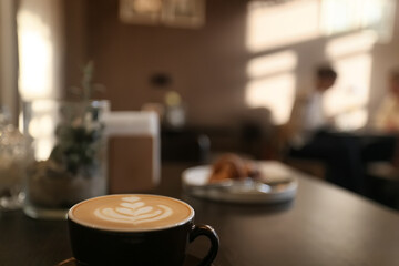 a cup of coffee in a cafe, photo morning coffee luvak cappuccino