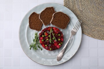Delicious vinaigrette salad with slices of bread on white table, flat lay