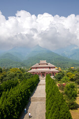 Chinese traditional pagodas and old buildings in a sunny day with mountains and blue sky on...