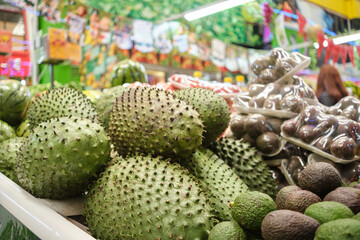 Soursop or graviola fruits for sale at the vegetable market stall.