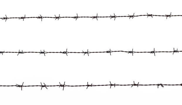 Old rusty security barbed wire fence isolated on white background