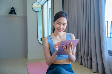 Asian girl Exercise by making yoga at the bedroom. Watch the video clip too. And exercise at the fitness