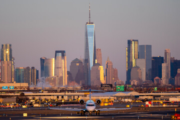Airplane of airlines is going on taxiway after landing in Newark airport the USA. Aircraft on background of New York