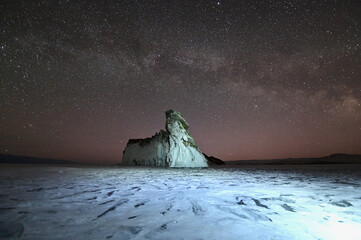 Night View of Dragon Tail Rock Under the Milky Way Galaxy at Frozen Lake Baikal