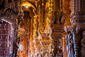 Wooden carving sculptures inside of the Sanctuary of Truth temple in Pattaya, Thailand