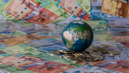 Miniature globe and Kazakhstani currency - tenge