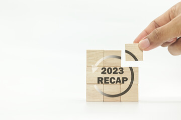 RECAP word icon on wooden cubes on white background and copy space. 2023 Recap economy, business,...