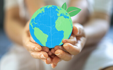 Hand of mother and kid child holding care saving clean energy earth globe world environment green eco friendly.campaign save the earth and earth Day 22 April