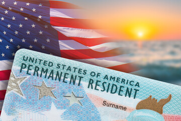 Green Card. US Permanent resident card. Immigration to USA. Electronic Diversity Visa Lottery DV-2024 DV Lottery Results. United States of America. American dream. Sunset, American flag on background - obrazy, fototapety, plakaty