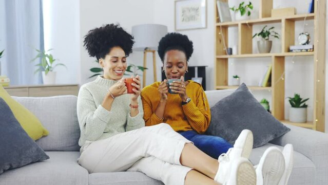 Happy, coffee and friends with women on sofa in living room for bonding, support and relax. Communication, chatting and self care with female at home for sharing, positive and happiness on break