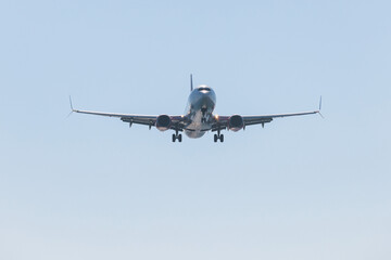 View of modern passenger plane aircraft in flight, commercial airplane flying in the sky before...